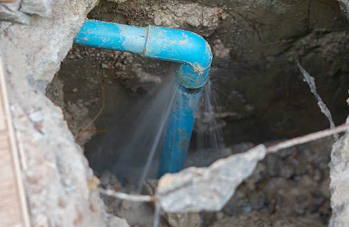 A broken water line causing water damage that requires extraction and structural drying.